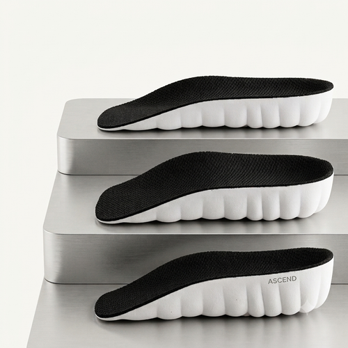 Three ASCEND insoles displayed on brushed metal steps, showing the 1.5 cm, 2.5 cm and 3.5 cm heights side by side