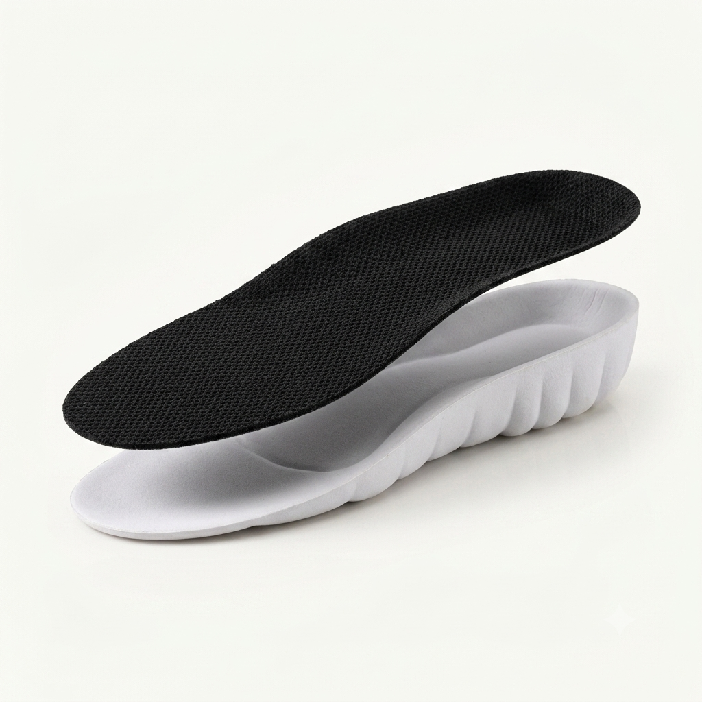 Exploded view of the ASCEND insole showing the black mesh top layer separated from the white PU foam base